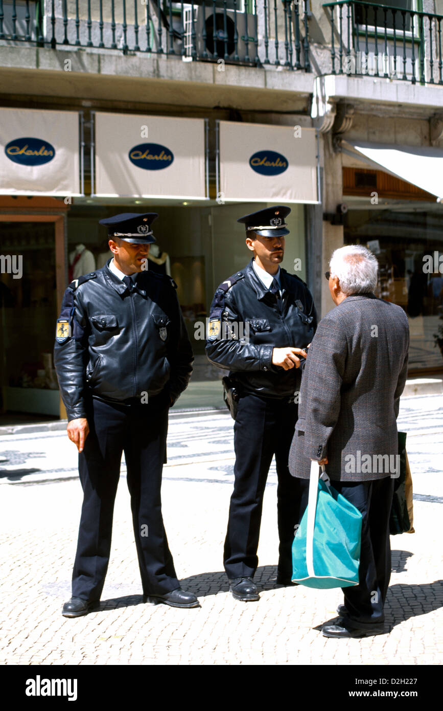 Baixa Lisbon  Portugal Rua Augusta Man Talking To Policemen Stock Photo
