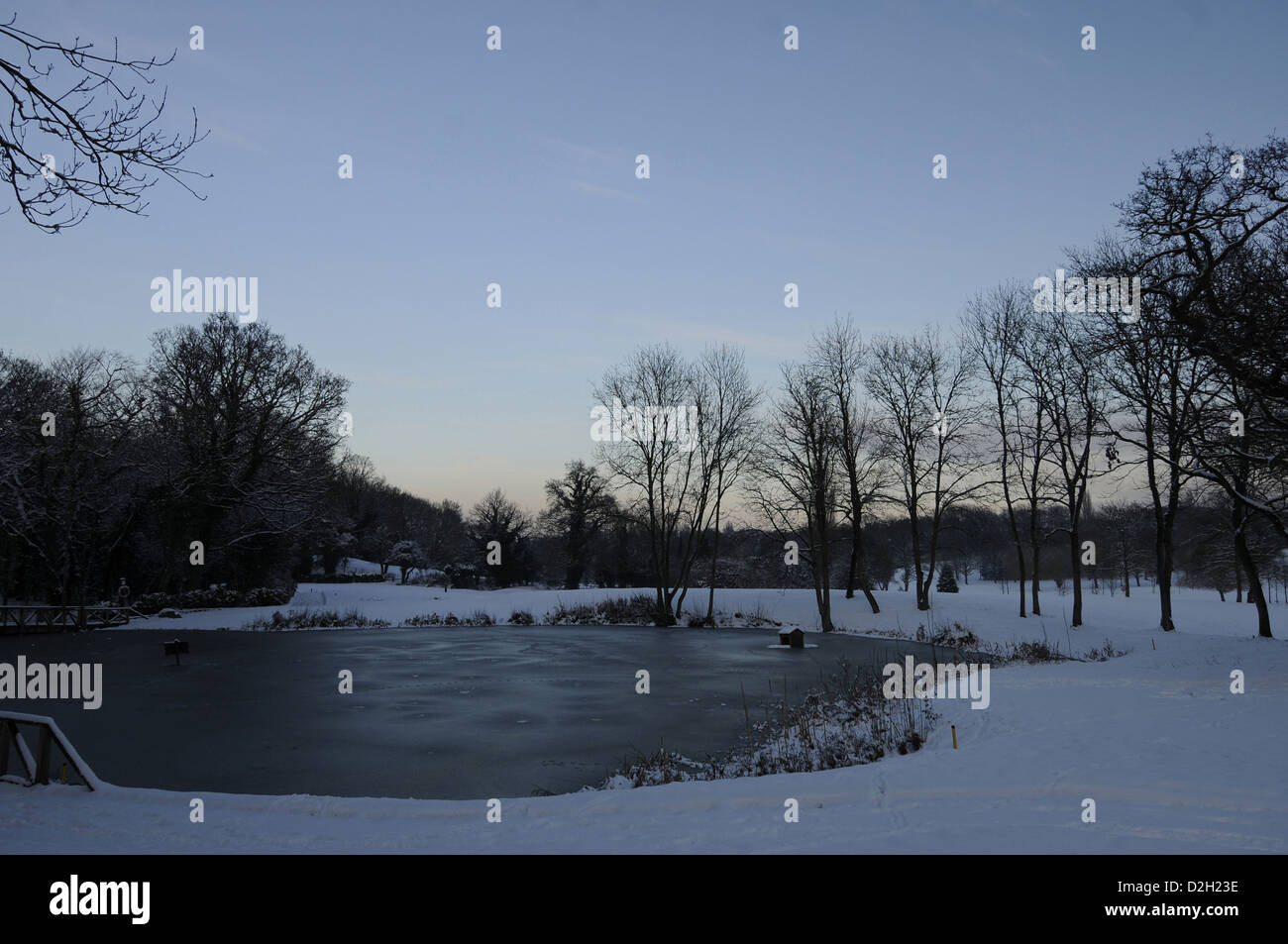 Frozen Pond on a snowy winters afternoon Bromley Kent England Stock Photo