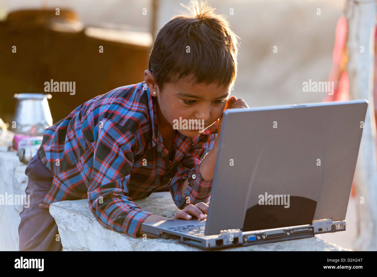 India, Rajasthan, Jodhpur, village boy using laptop Stock Photo - Alamy