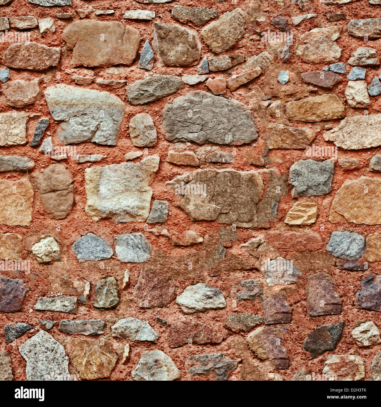 Red wall with natural different size stones seamless texture Stock