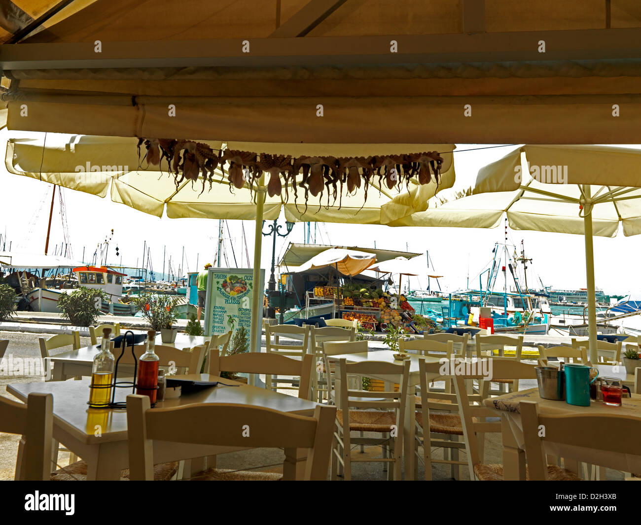 Aegina Greece Empty Restaurant By The Sea Drying Octopi Stock Photo