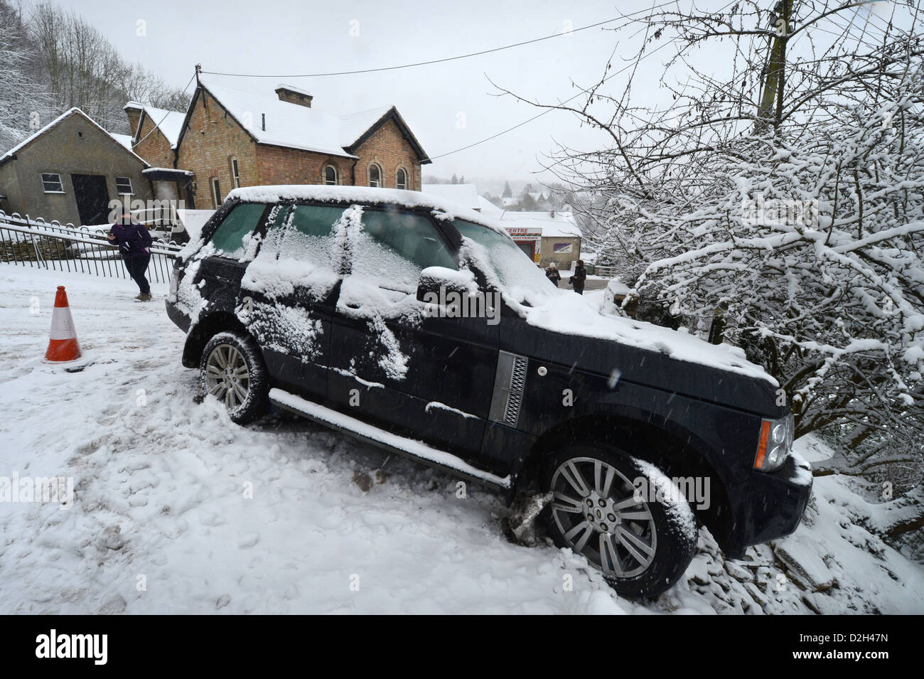 A Range Rover which hit a stationary Vauxhall forcing it into gardens below on a hill known locally are 'The Ladder' in Nailswor Stock Photo