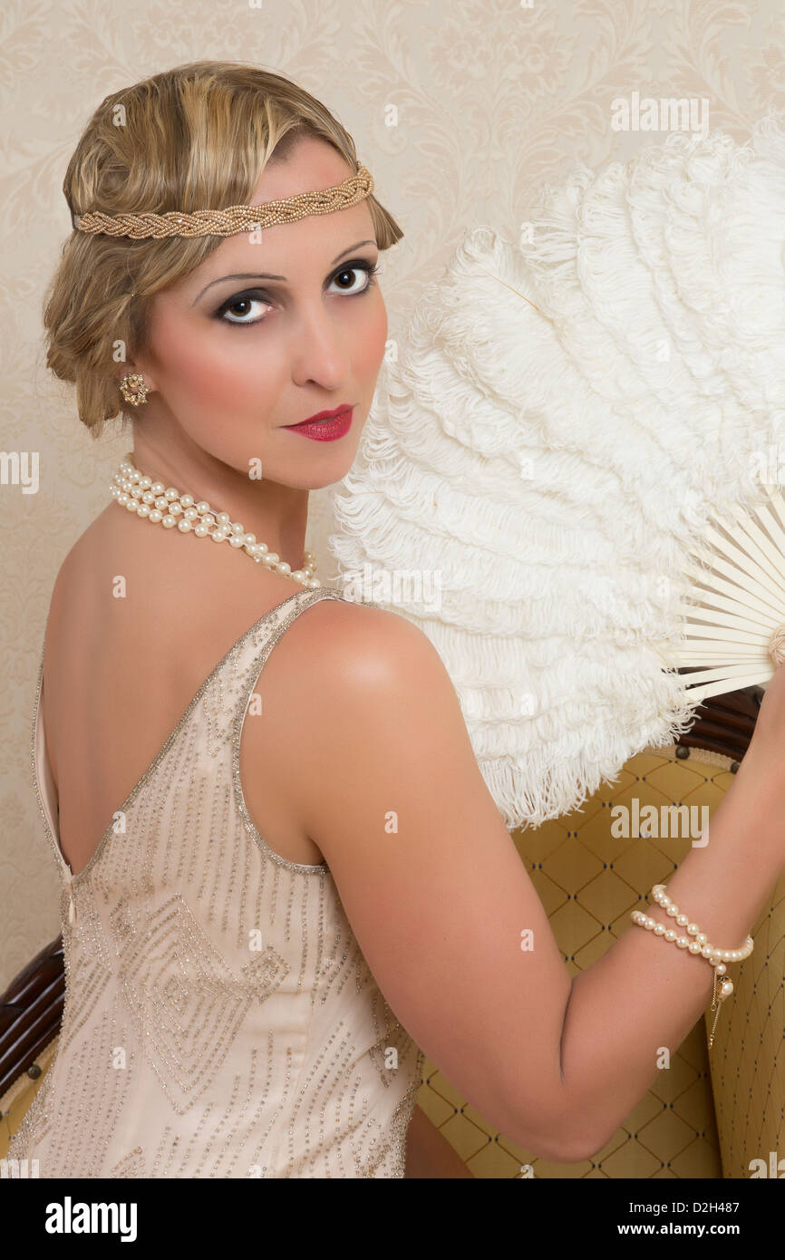 Vintage twenties lady wearing a headband and flapper dress Stock Photo