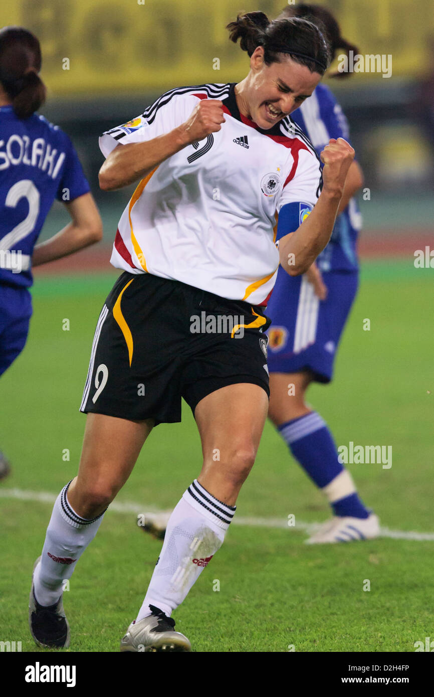 Germany team captain Birgit Prinz celebrates after scoring a goal in a FIFA Women's World Cup Group A match against Japan. Stock Photo