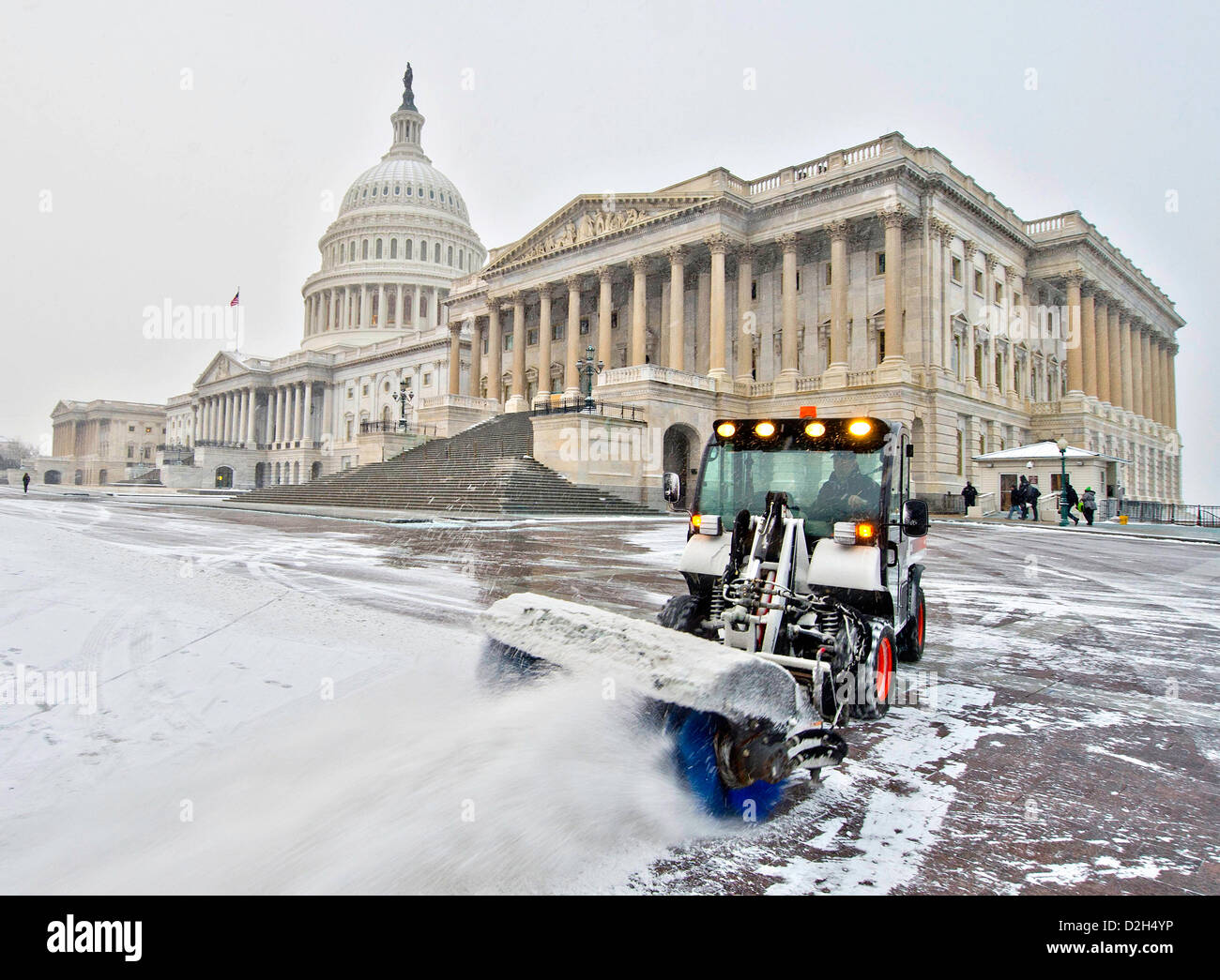 Washington DC, USA. 24th January 2013. Work crews clear the east front of the US Capitol from a winter snow January 24, 2013 in Washington, DC. The storm was the first widespread snow in the area following a massive cold wave across the northeast. Credit:  Planetpix / Alamy Live News Stock Photo