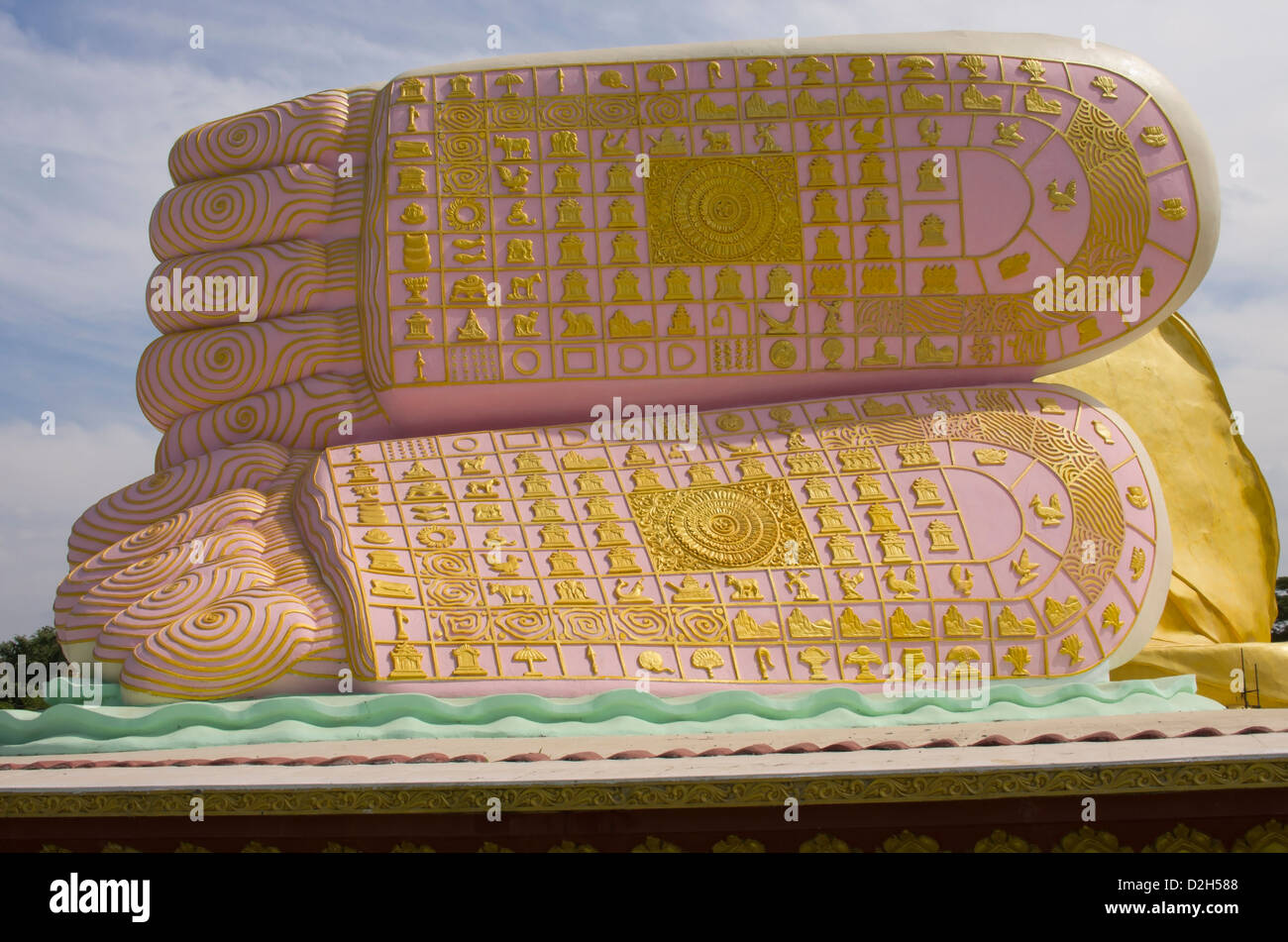 reclining Buddah feet showing the 108 distinguishing marks of the buddah. Stock Photo