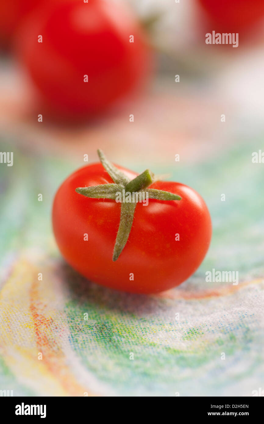 Cherry Tomatos on colorful background Stock Photo - Alamy