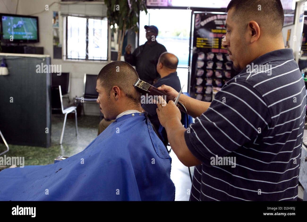 young hispanic locals getting haircuts at Oaxaca barber shop ON La
