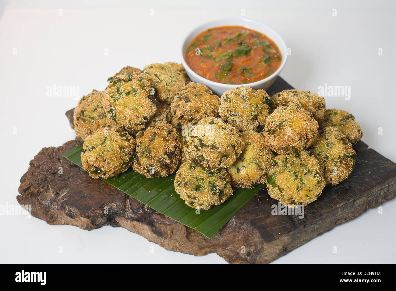 Fishcakes with spicy tomato and basil sauce at restaurant owned by Yotam Ottolenghi, Upper Street, Islington, London, UK Stock Photo