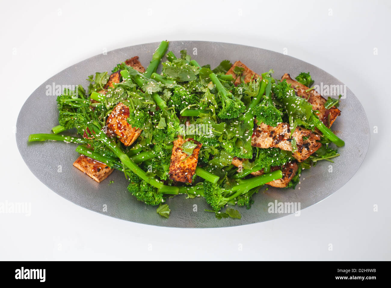 Ottolenghi's broccolini with tofu, sesame and coriander at Yotam Ottolenghi's restaurant in Islington, London, UK Stock Photo