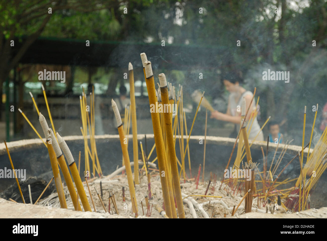 Buddhist ritual of Incense offerings placed in a censer at the entrance of Po LIn Monastery