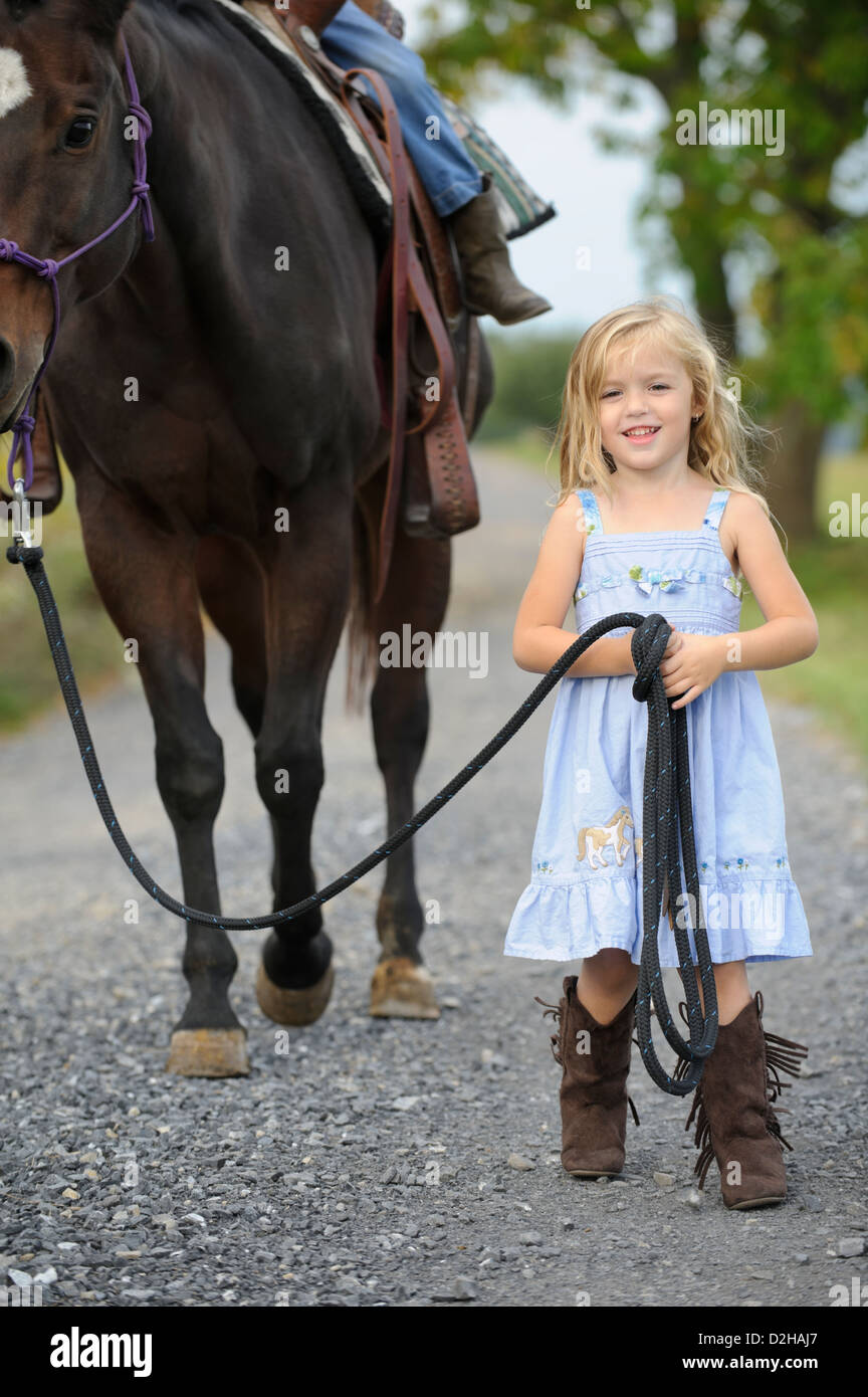Girl wearing cowboy boots hires stock photography and images Alamy