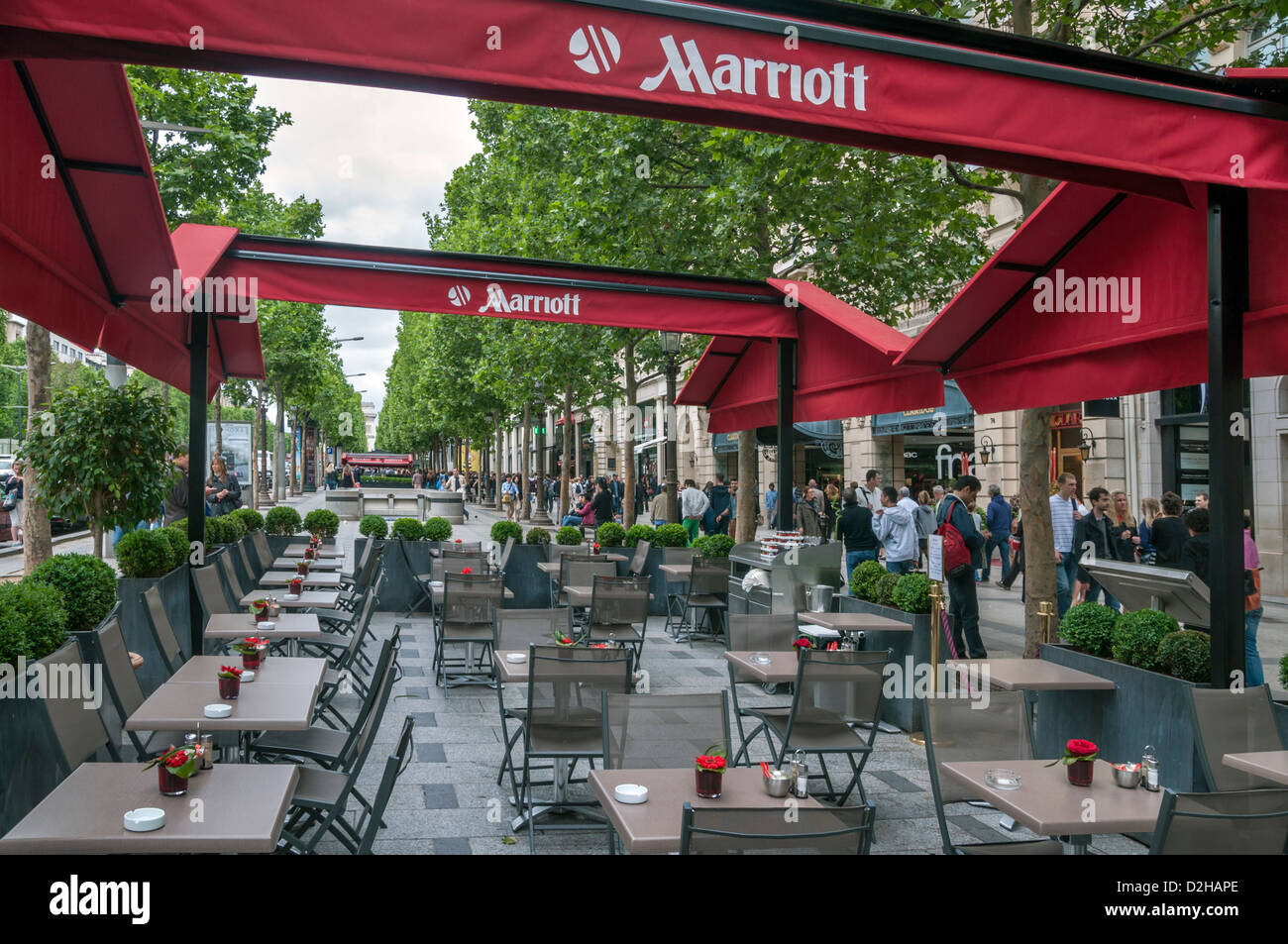 Outdoor cafes and shops along Avenue des Champs-Elysees in Paris,France Stock Photo