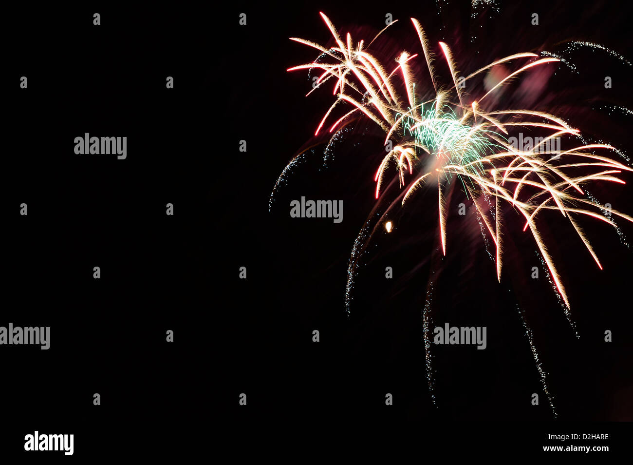 Fireworks explosions against the night sky in holiday celebration, a burst of color for use as design elements and backgrounds. Stock Photo