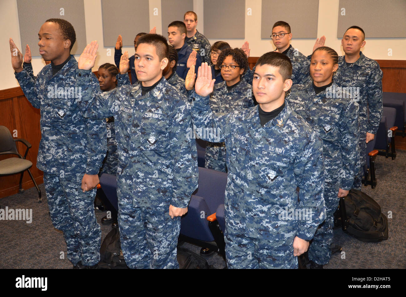 Great Lakes, Illinois, USA. 24th January 2013. Twenty-one US Navy recruits at Recruit Training Command take the Oath of Allegiance to become United States citizens January 22, 2013 in Great Lakes, IL. Under a program in acted in 2012 he Citizenship and Immigration Services in partnership with RTC has expedited citizenship for more than 1,650 recruits during boot camp training. Credit:  US Navy Photo / Alamy Live News Stock Photo