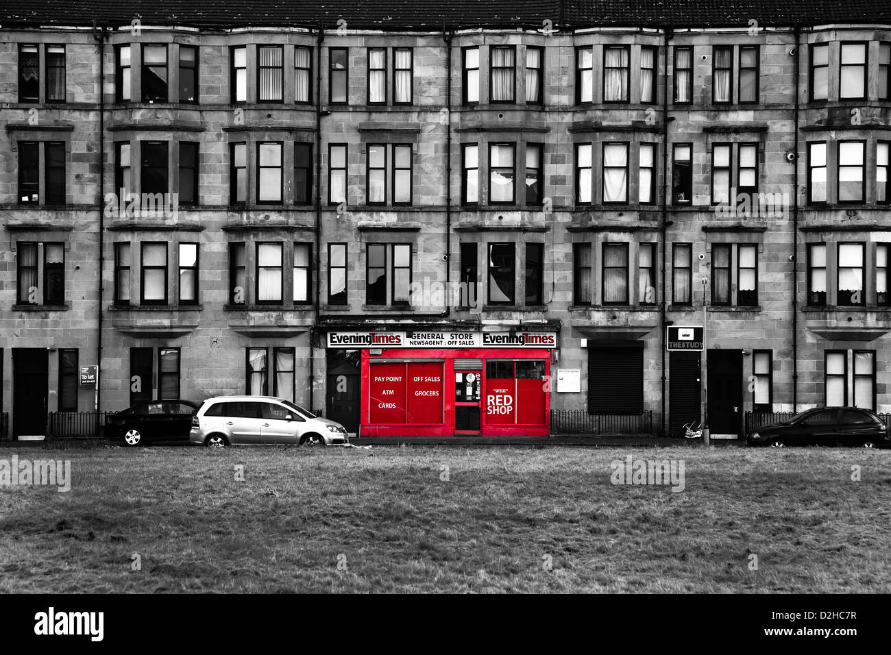 Traditional sandstone tenement building with red shop front, Govan, Glasgow, Scotland, UK Stock Photo