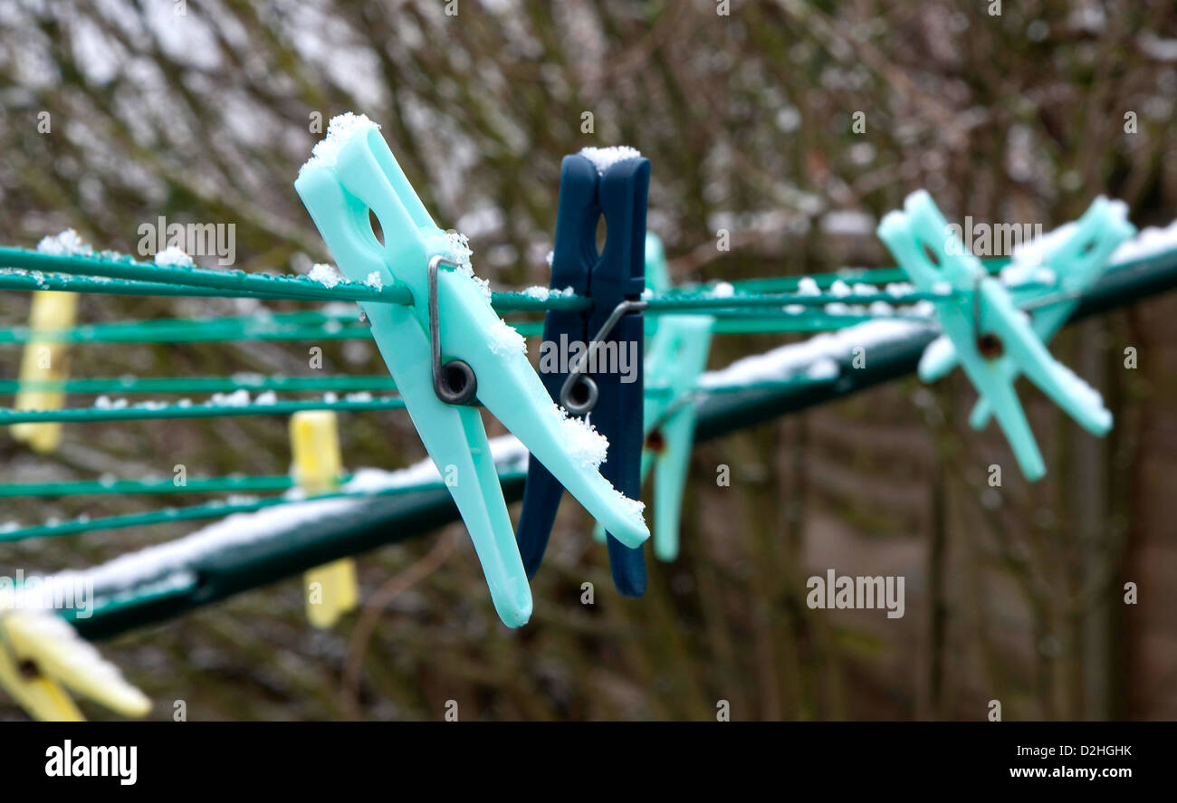 Icy Clothes Pegs Pins on a Washing Line Stock Photo