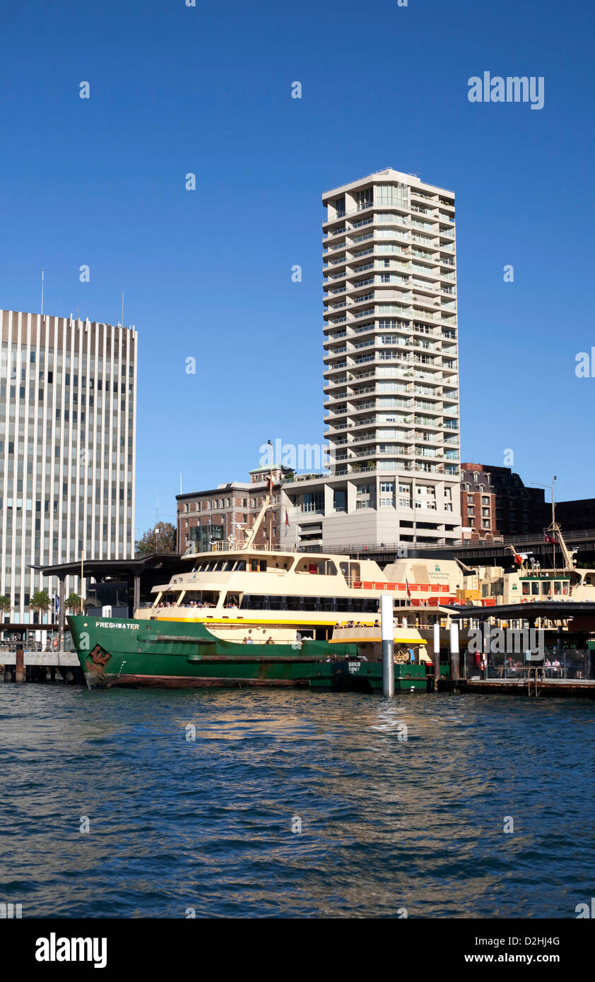 The Manly Ferry 'Freshwater' at Circular Quay Sydney Australia with the Apartment Building Quay West showing in the background. Stock Photo