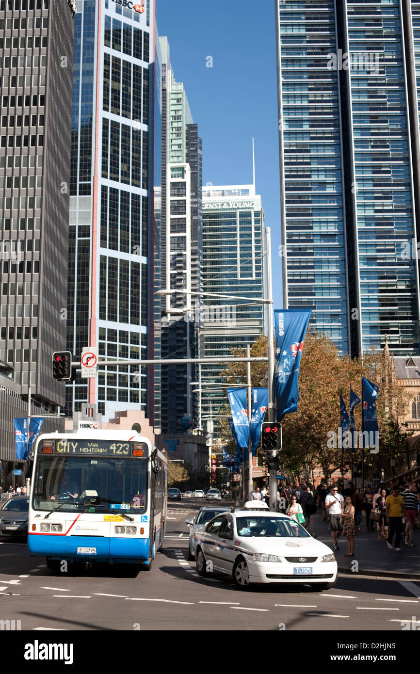 Examples of public transport a Sydney City Bus and Taxi on George Street Sydney Australia Stock Photo
