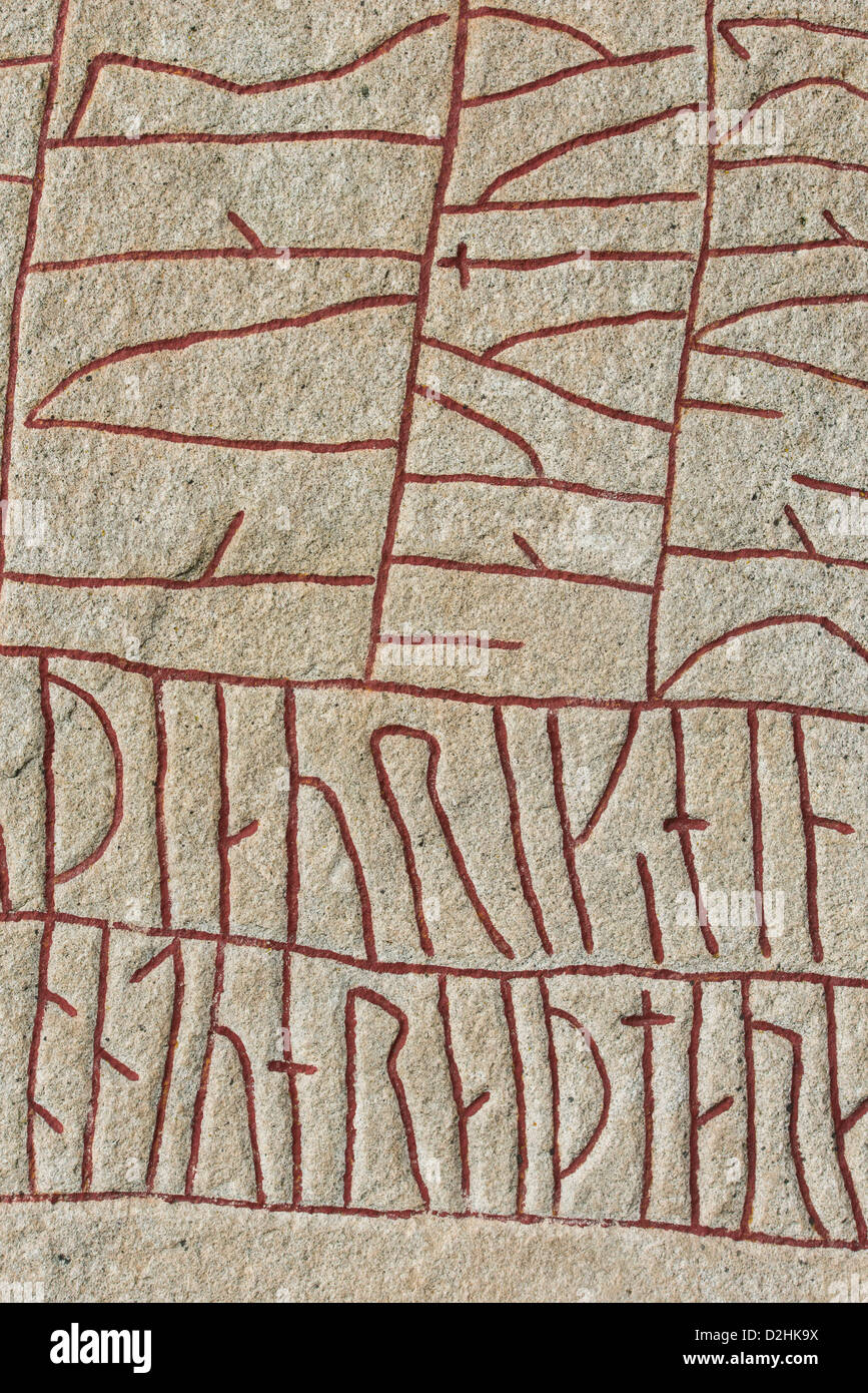 Old historic nordic runes engraved in stone. The stone is located at