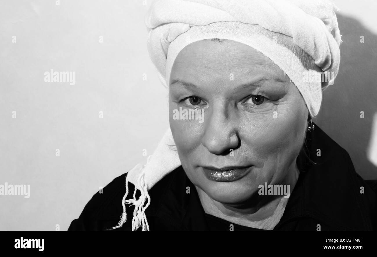 black and white portrait of middle aged woman in scarf Stock Photo