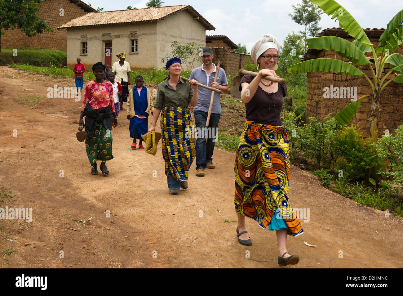 Tourists enjoying a village experience with Azizi Life, village near Muhanga, Rwanda Stock Photo