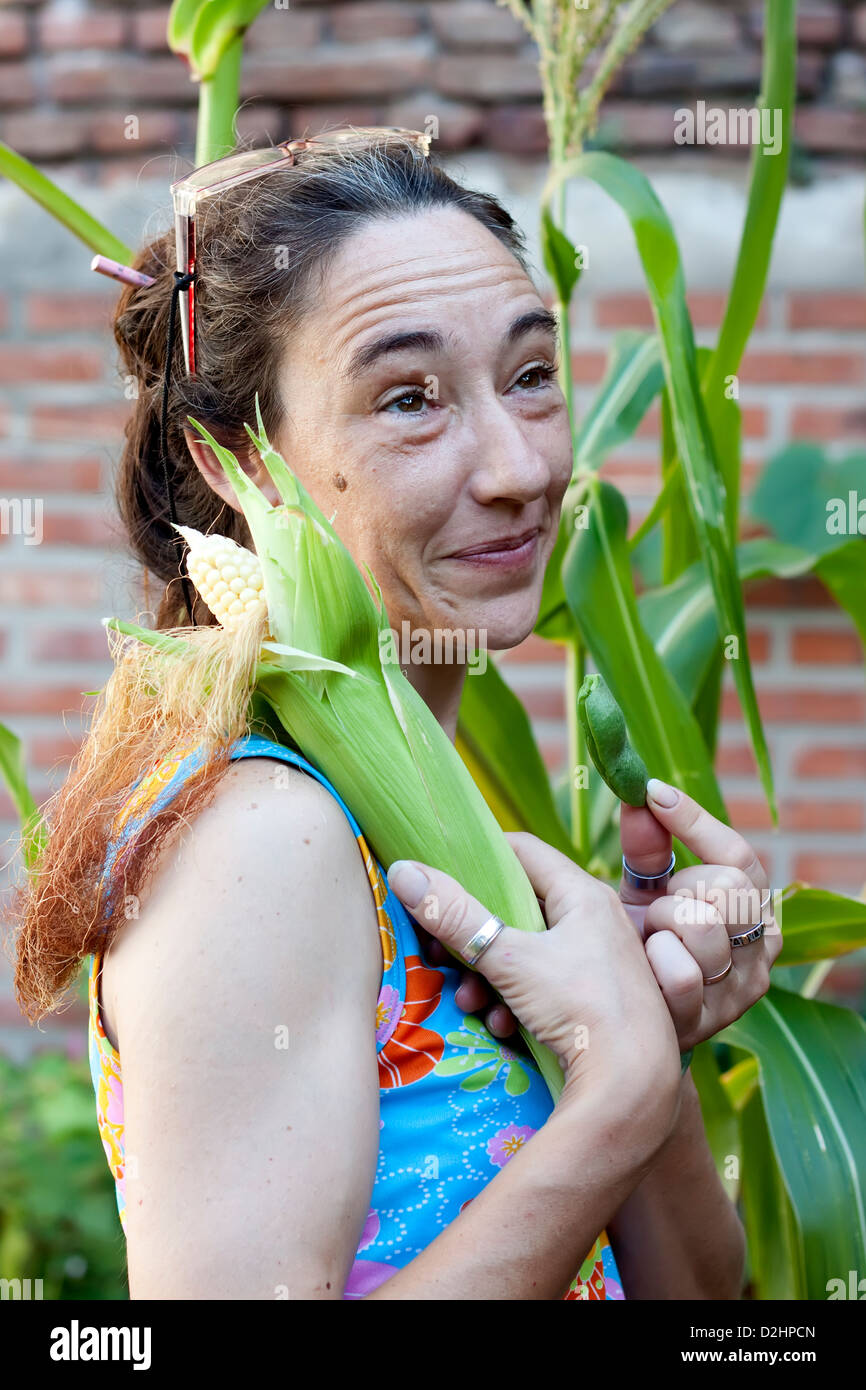 woman in the garden with corn Stock Photo - Alamy