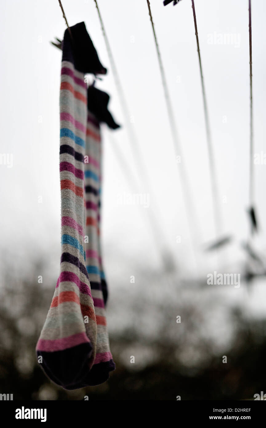 Pair of wet socks hanging on a rotary washing line Stock Photo Alamy