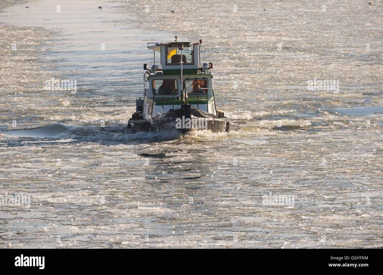 The boat 'Spandau' of the Water and Shipping Authority (WSA) sails on the Spree river in Berlin, Germany, 25 January 2013. Sub-zero temperatures let the rivers freeze. Photo: SOEREN STACHE Stock Photo