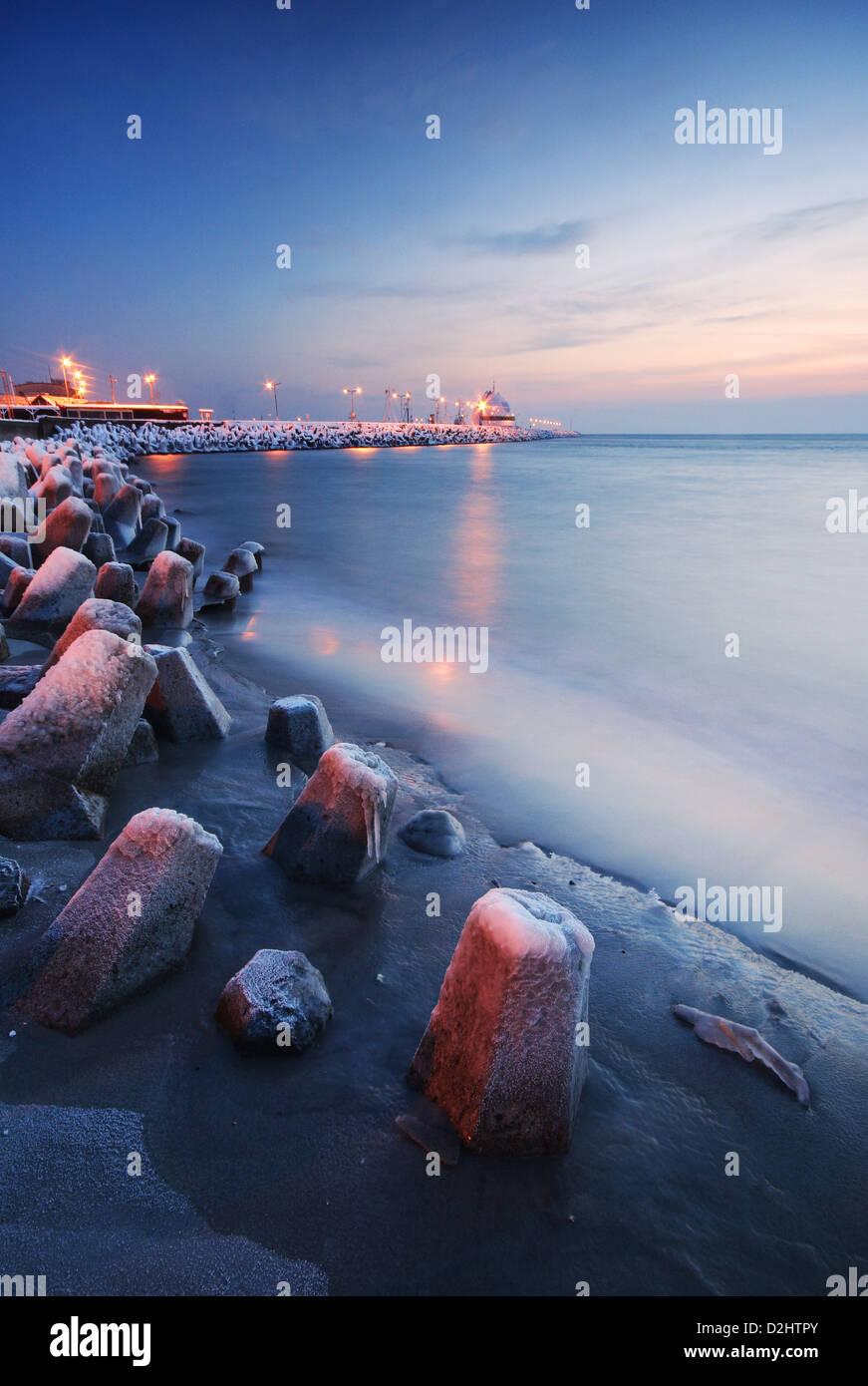 Beautiful winter twilight on a frozen beach in Hel Peninsula, Polish Baltic coast. Stock Photo