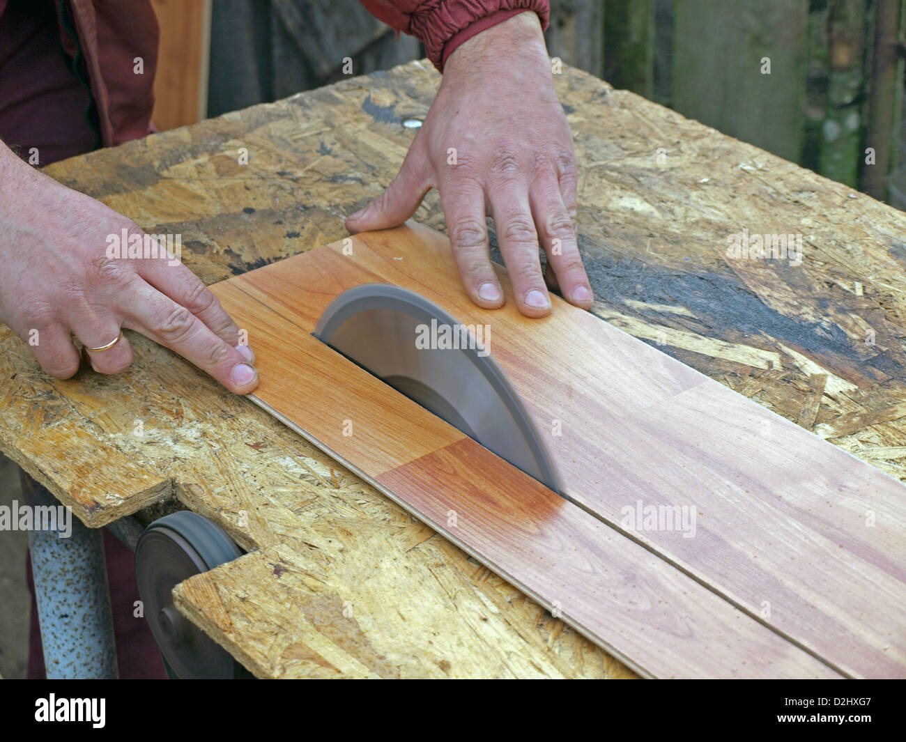 Sawing floor laminate on homemade circular saw Stock Photo Alamy