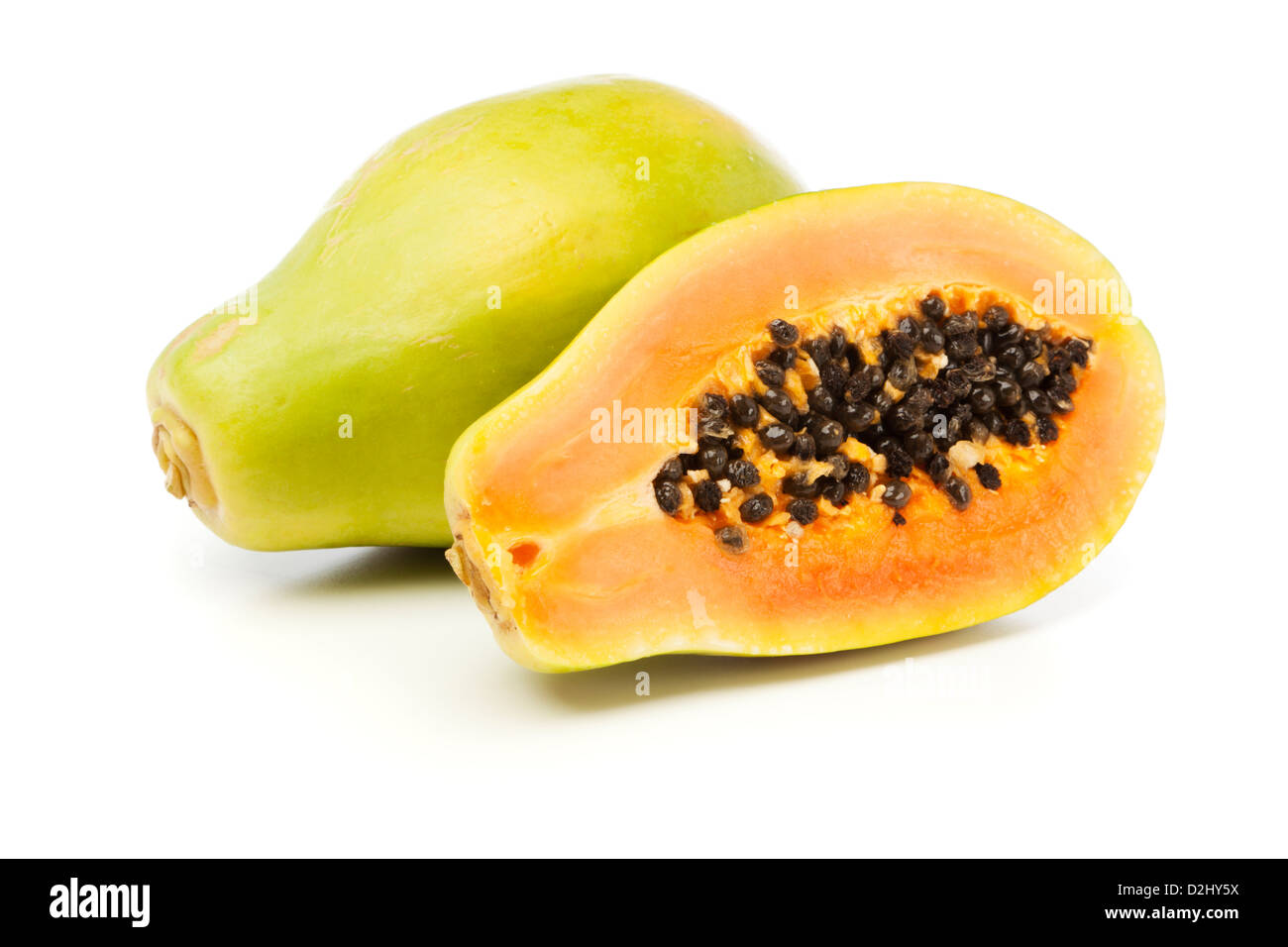 Whole and half Papaya fruits on white background Stock Photo