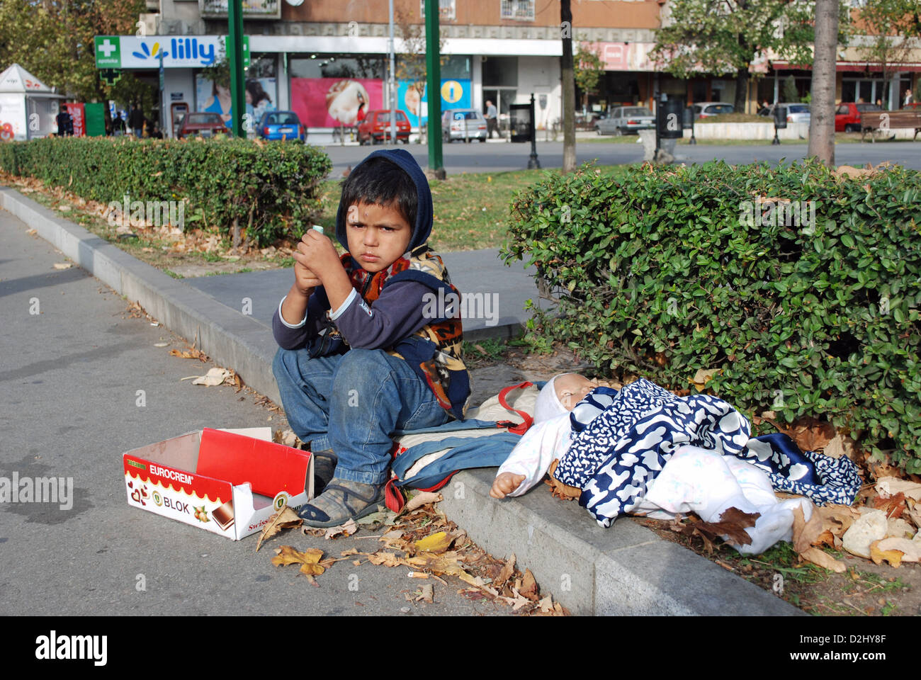 A Roma child begging in street in Belgrade Stock Photo