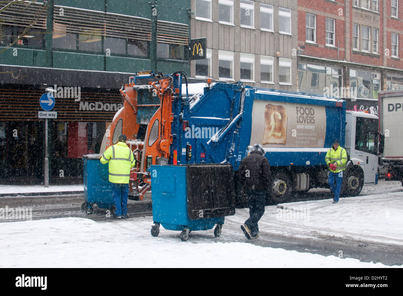 Refuse collection vehicle in snowy weather, Coventry city centre, UK Stock  Photo - Alamy