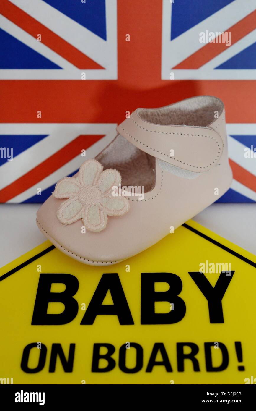 A babyshoe is laying in front of the Union Jack. Photo: Frank May Stock Photo