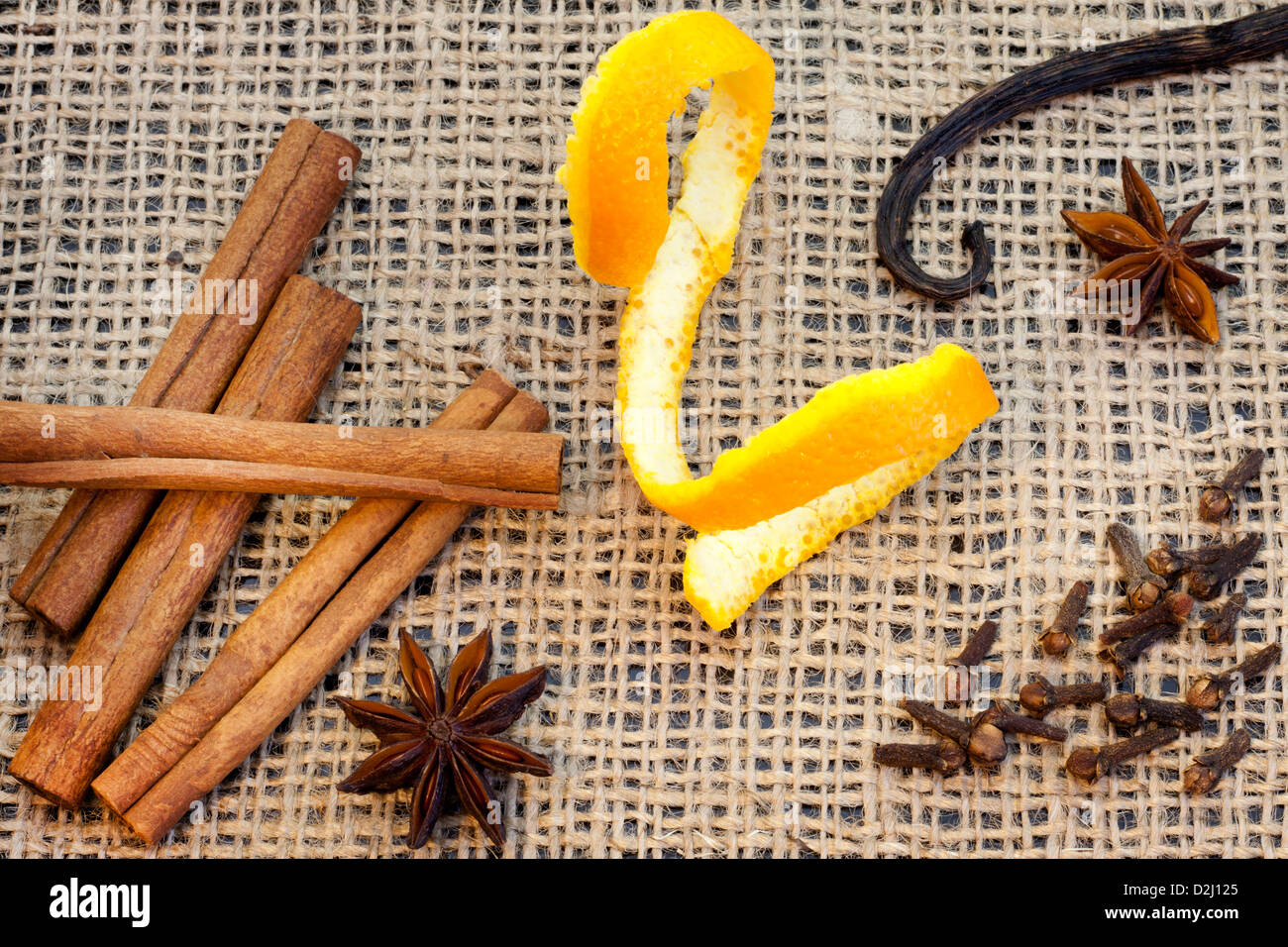 Aroma spices cinnamon anise vanilla and cloves on jute Stock Photo