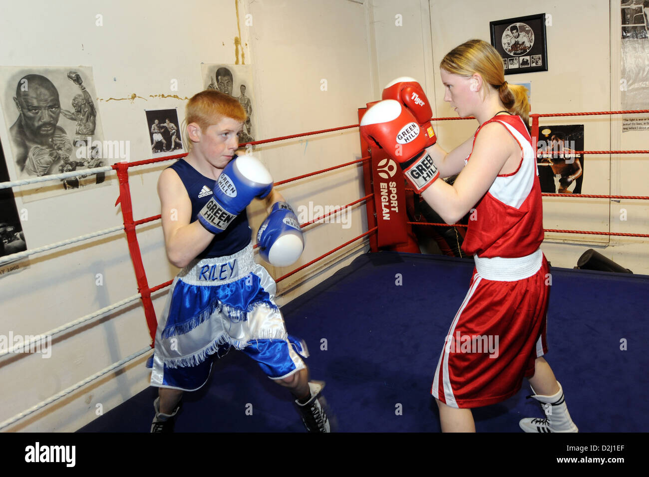 Boy and girl box at a Boxing Club South Yorkshire UK Stock Photo