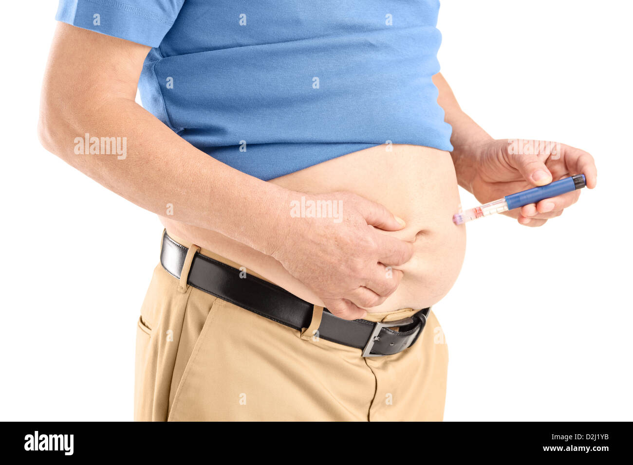 Mature man injecting insulin in his abdomen isolated on white background Stock Photo