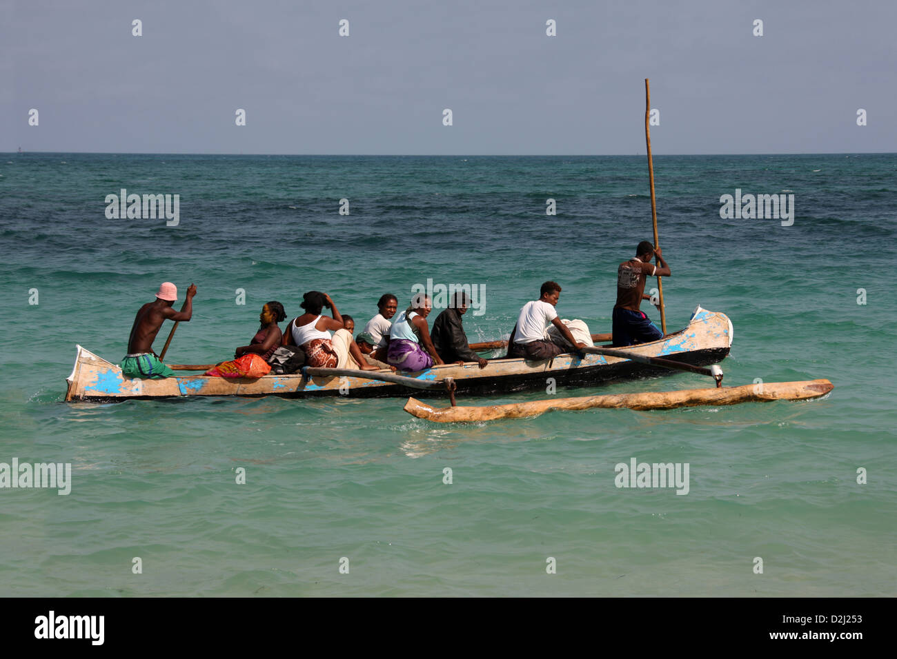 A Group of Malagasy People in an Pirogue Outrigger Boat at Tulear, Anakao, Madagascar, Africa. Local Taxi Service. Stock Photo