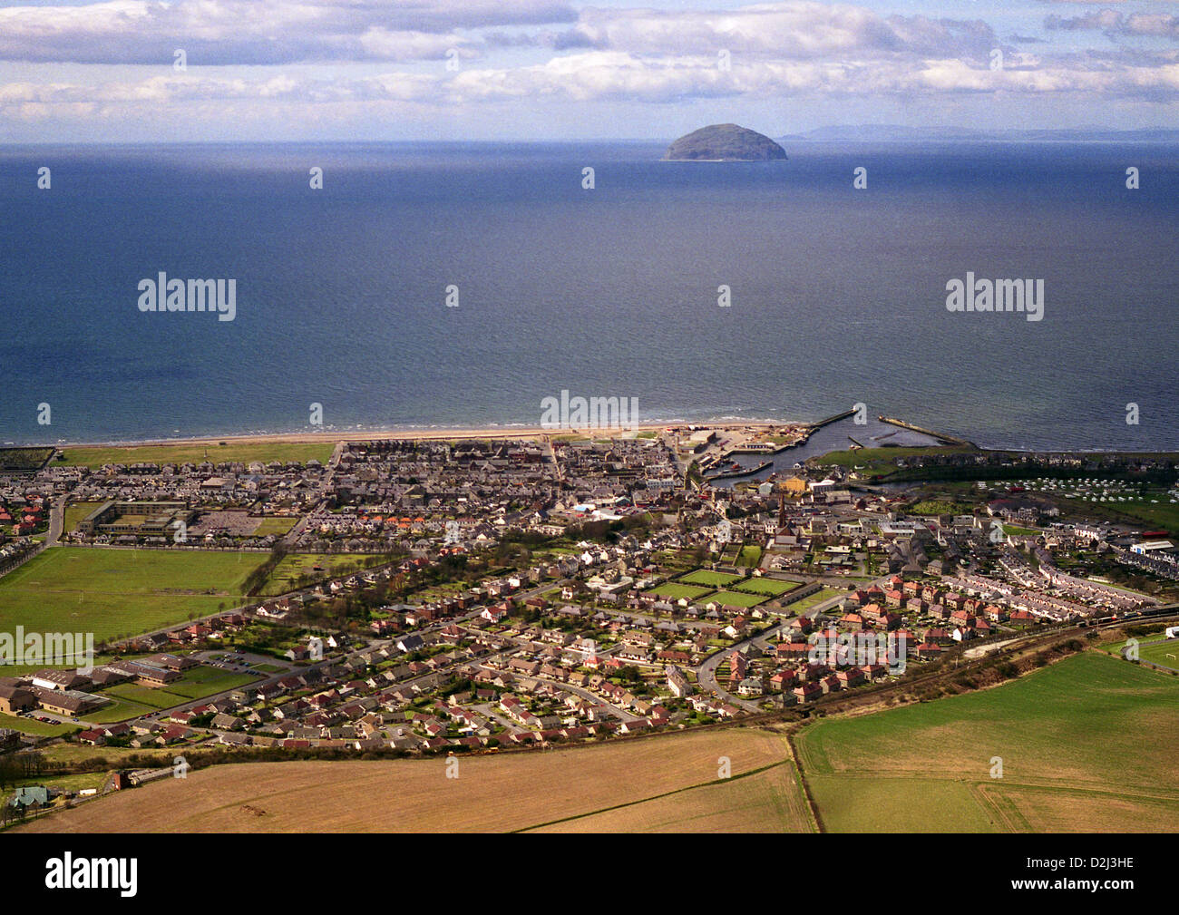 Aerial view of Scottish town of Girvan with the island of Ailsa Craig