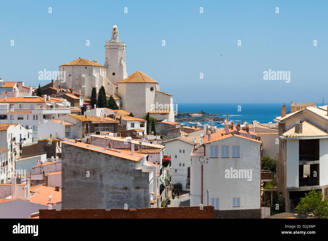 Panorama of white village houses and church tower in Cadaques, Spain Stock Photo