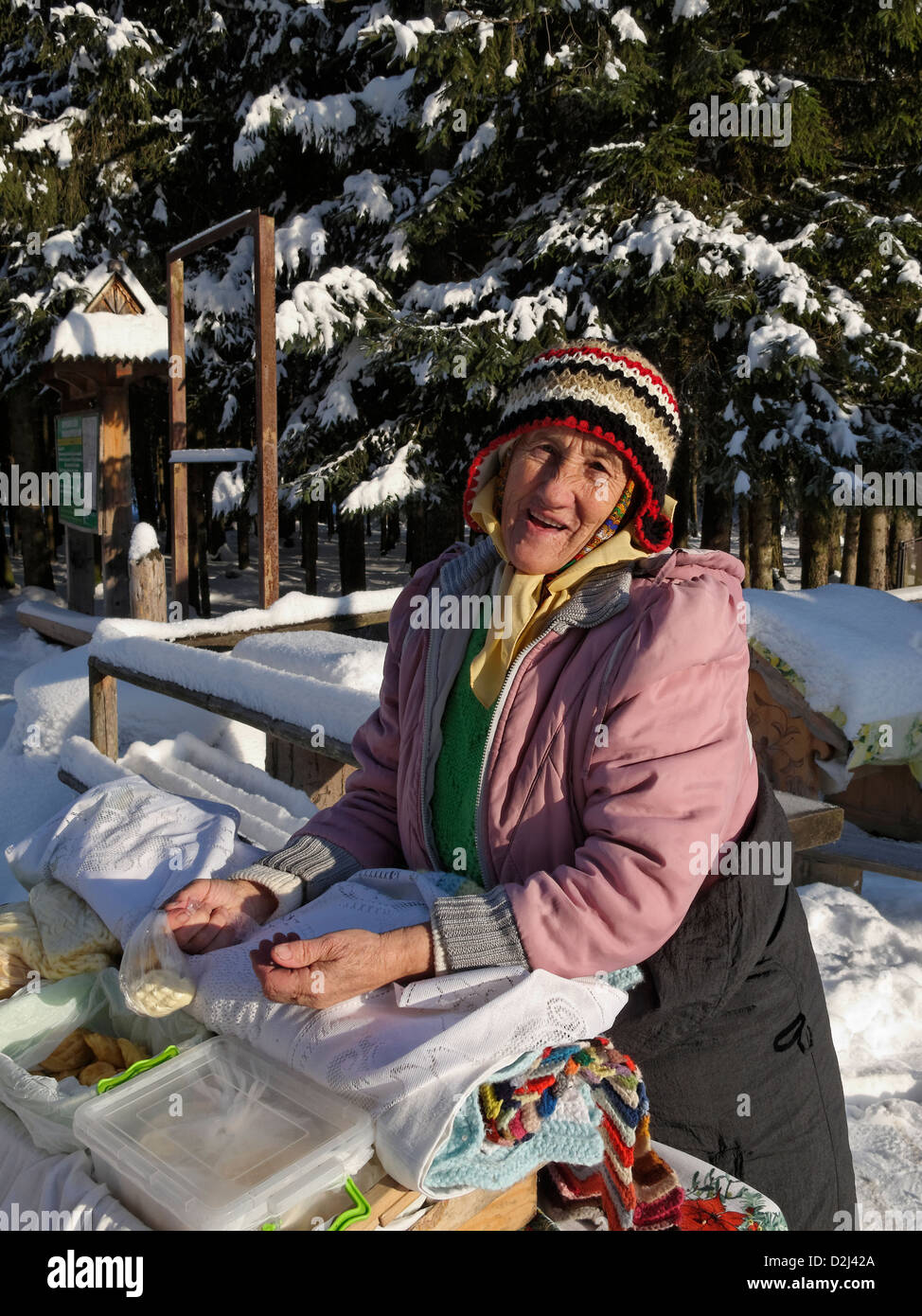 A lady selling oscypek (smoked cheese) at Zakopane, Poland. Stock Photo