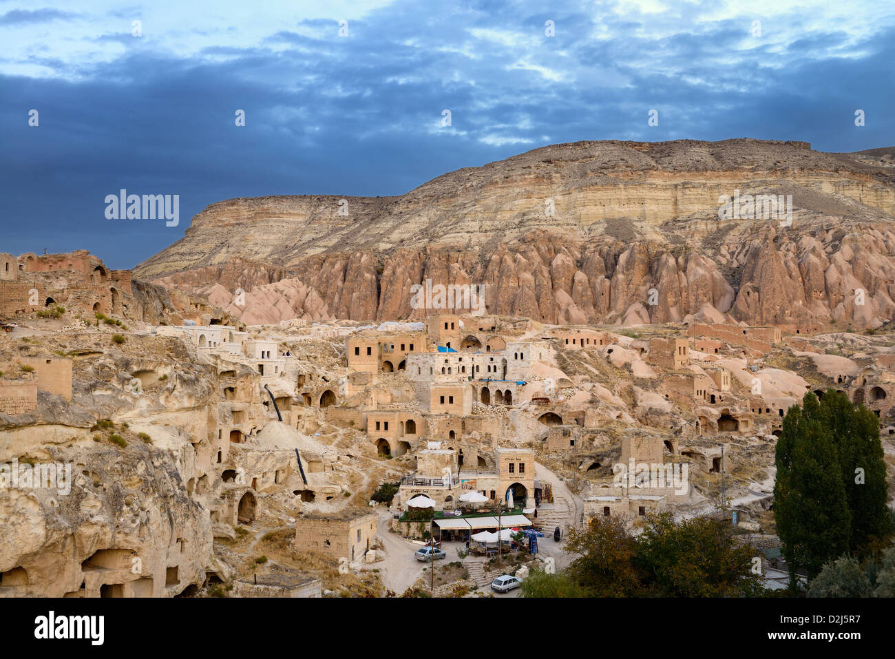 Redevelopment of ancient stone dwellings in hilltop village of Cavusin in Cappadocia Turkey Stock Photo