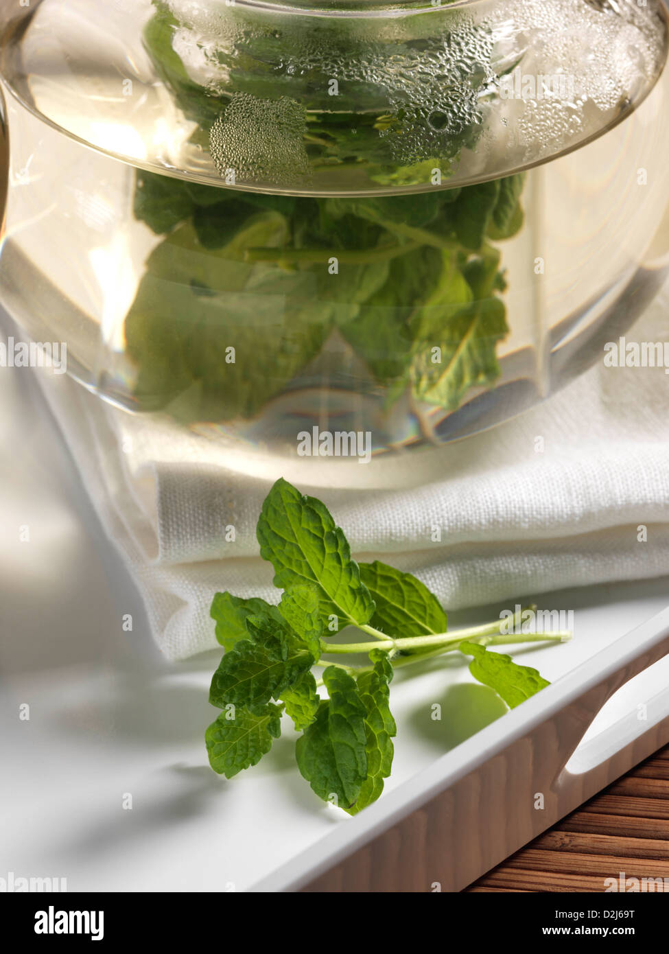 Mint tea in a glass teapot Stock Photo