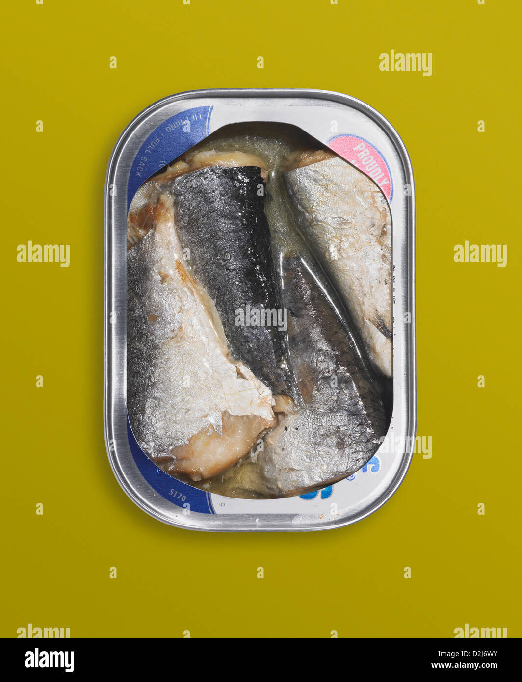 Canned herring on a yellow background Stock Photo Alamy