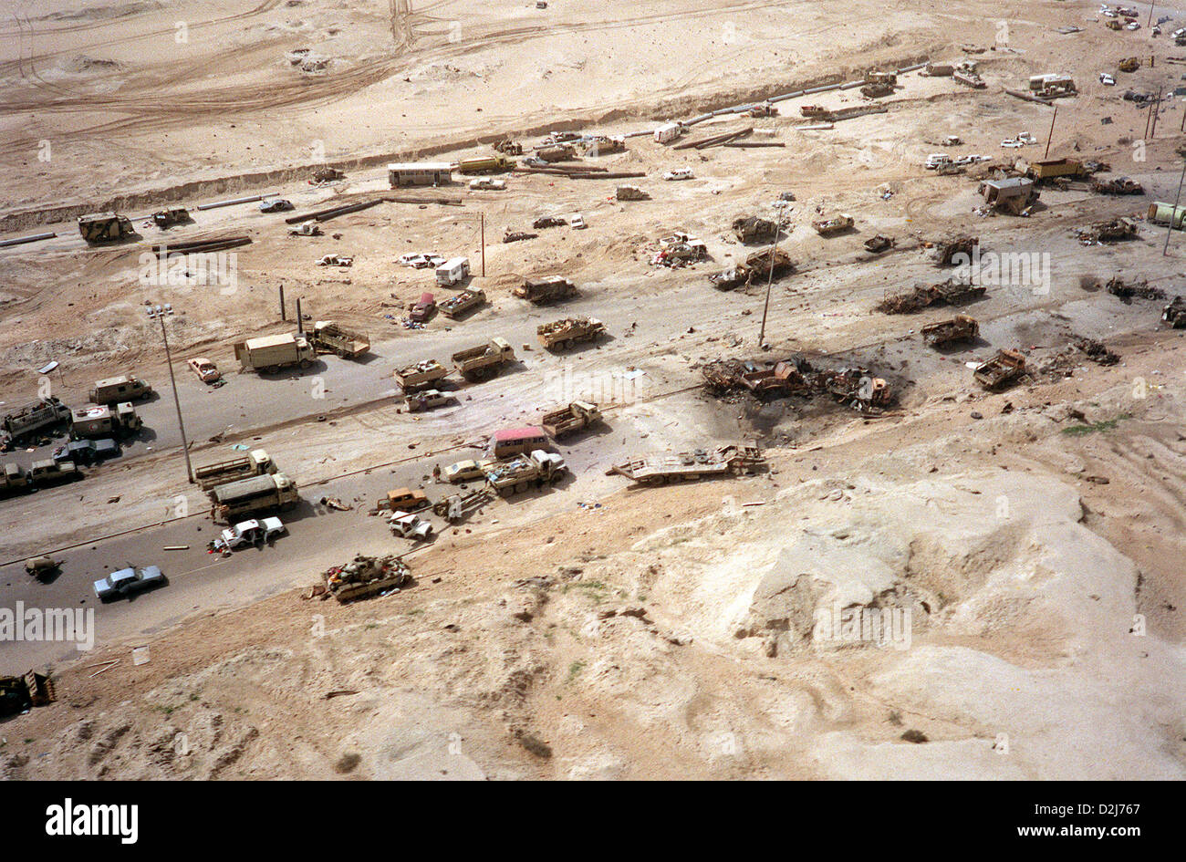 Destroyed Iraqi armored vehicles litter Highway 80, known as the Highway of Death destroyed by coalition aircraft during the Gulf War February 28, 1991 in Kuwait. Stock Photo