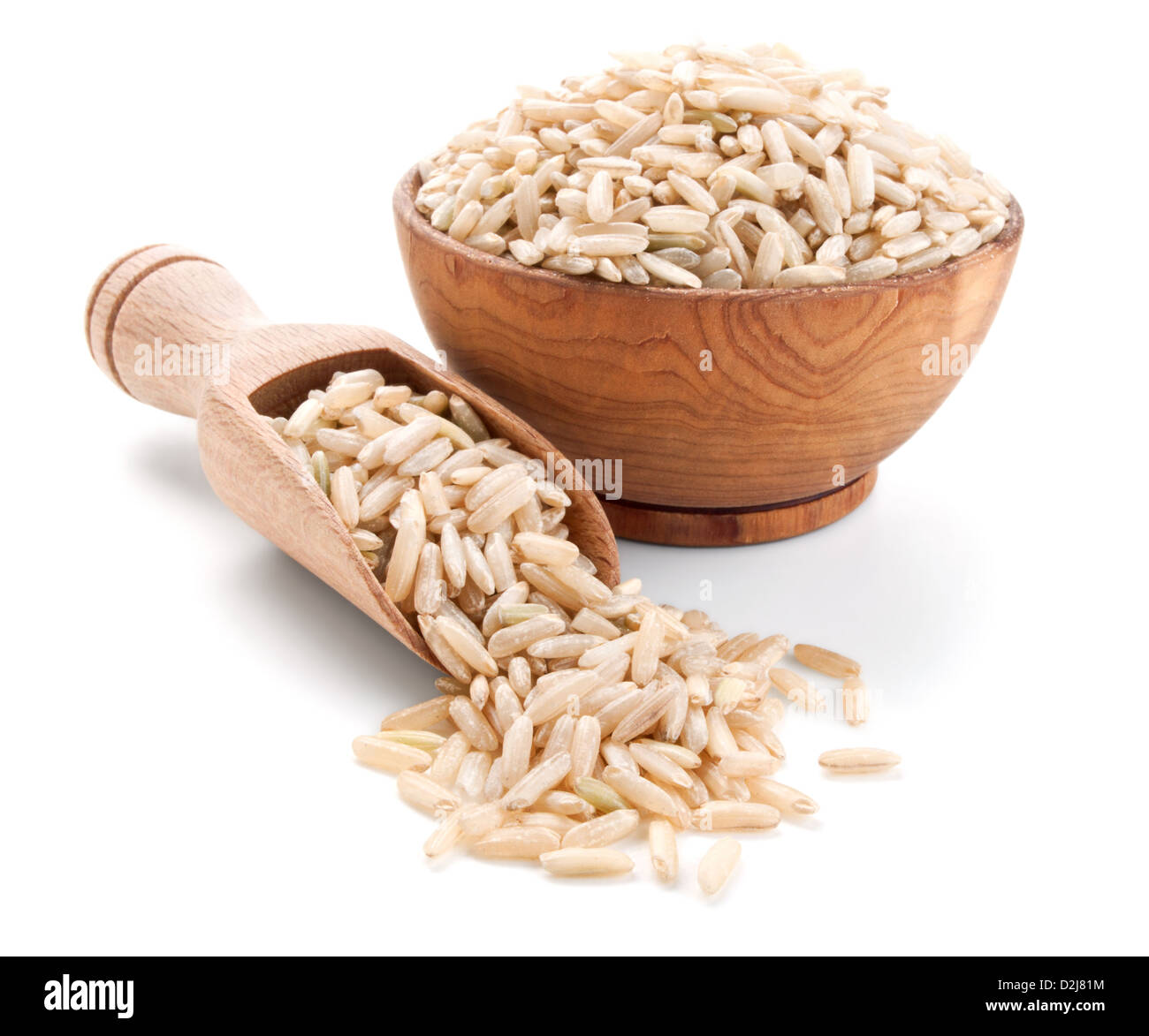 unpolished rice in a wooden bowl isolated on white background Stock Photo