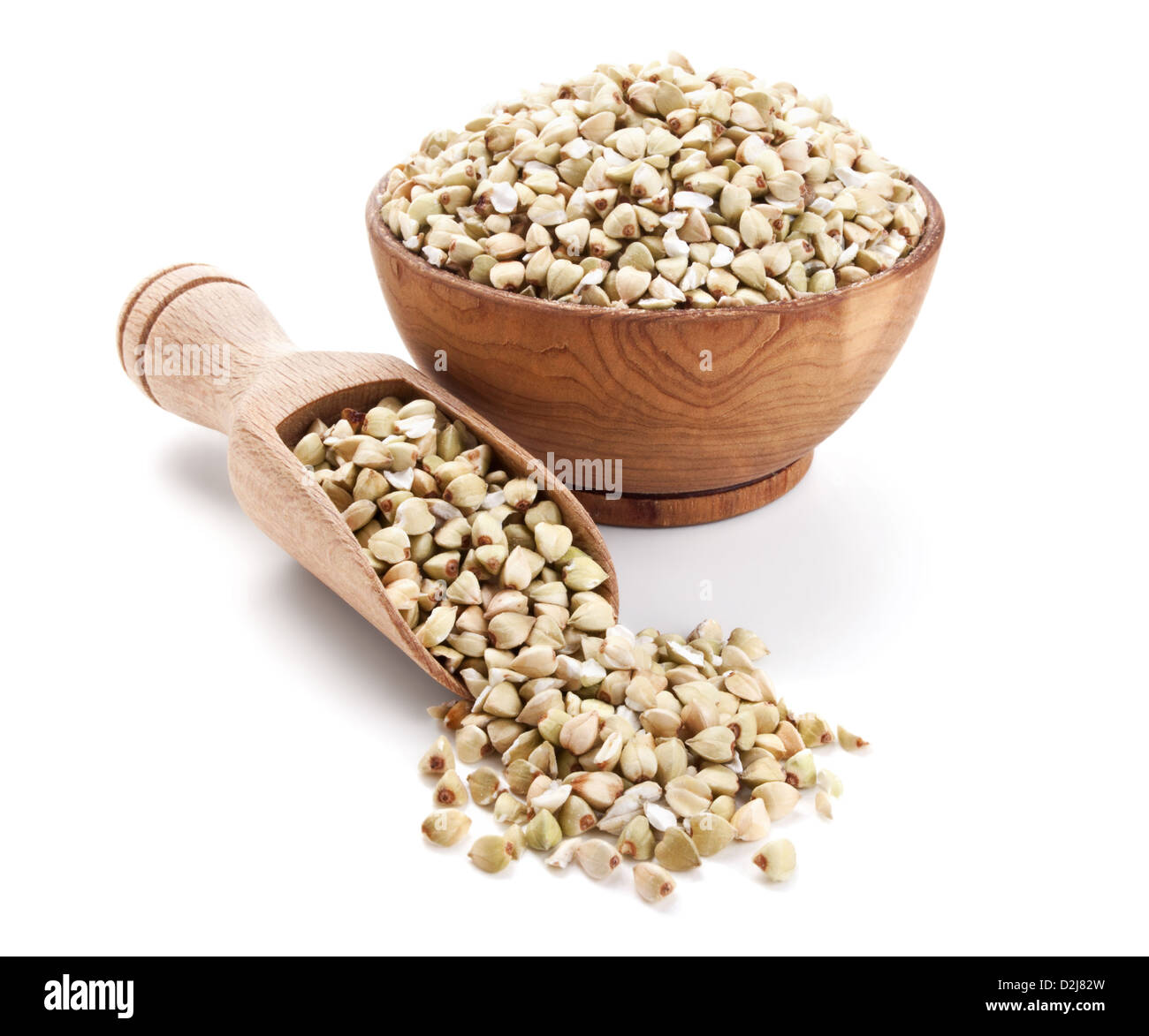 raw buckwheat in a wooden bowl isolated on white background Stock Photo