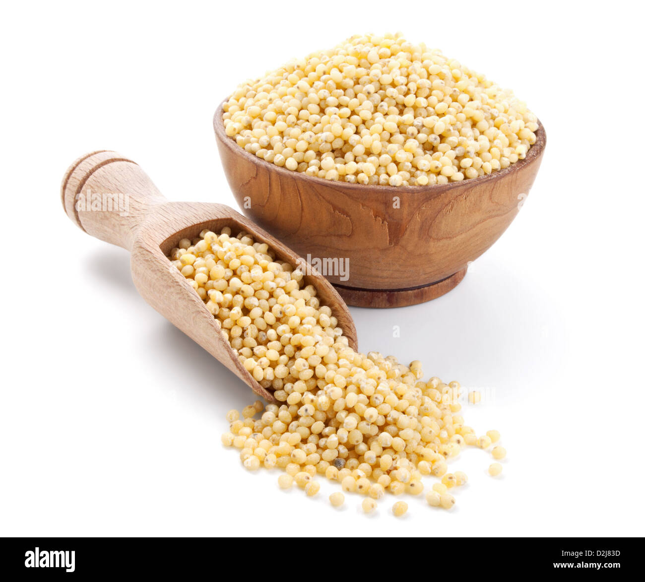 millet in a wooden bowl isolated on white background Stock Photo
