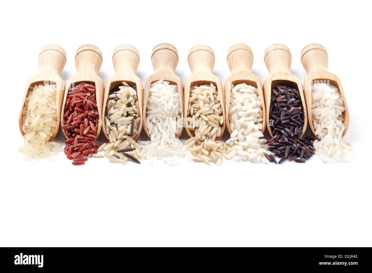 Slops Food Rice Wooden scoops with different rice types scattered from them on white ...